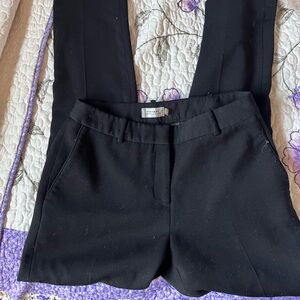 Black tailored trousers with a nice fit and a good amount of stretch.